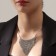 The necklace "waterfall" is a triangle, white color in silver, 35 cm