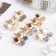 Earrings with rhinestones "vine", color mix in gold