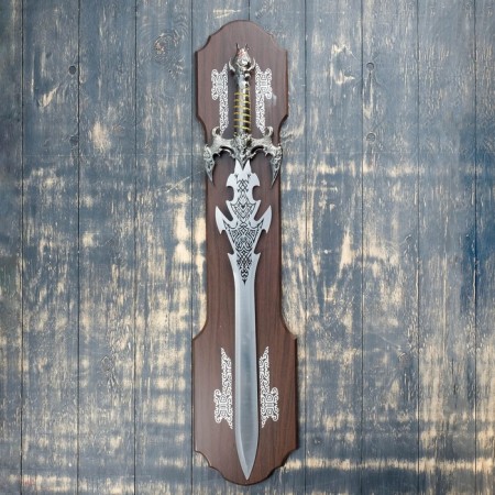 Souvenir sword on a tablet, carved blade, gold hilt with the head of a dragon