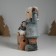Souvenir Ceramics Light "Baby in a gray coat, with a penguin on the gift" 12x6.5x20 cm