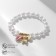 Bracelet Pearl "Margeri" shells and a bear, the color is pink-white