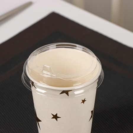 A plastic disposable lid for a glass, with a nose, d = 8 cm, the color is transparent