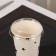 A plastic disposable lid for a glass, with a nose, d = 8 cm, the color is transparent