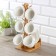 Tea ceramic tea on a wooden stand “Estet”, 12 objects: 6 cups d = 8.6 cm 200 ml, 6 Smarks 14.5 × 10.6 cm, white color