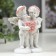 Polystone souvenir "Angels in pink wreaths with heart from roses" 10x8.5x5.5 cm