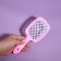 The comb is massage, wide, ventilated, 8.5 × 20.5 cm, PVC box, pink/white color