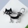 Brooch "cat" flirty with a bow, black color in black silver