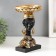 Souvenir Polystone stand "African in a golden device, with earrings in the ears" 25x15x15 cm