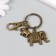 Keychain metal with carbine "Elephants" bronze 6.5 cm