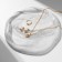 Set 3 objects: earrings, pendant, ring, size mix (16-18) “heart”, white color in gold, 40 cm
