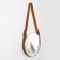 Mirror wall -mounted round “surroundings” d mirror surface 28 cm, with an artificial leather strap, color mix