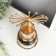 Summary metal per 1 candle "Ferris wheel" gold in black marble 20x14x9 cm
