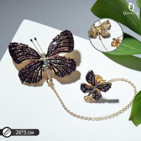 A brooch with an icon on the chain "Butterfly", the color is purple in gold