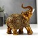 Polystone souvenir "Elephant with a golden blanket with patterns and rhinestones" 15x14x7 cm