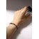 Bracelet with rhinestones "shine" on a puff, colored in silver