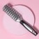 The comb is massage, ventilated, 5 × 23 cm, silver/black color
