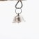 A toy for birds with a bell and mineral stone, 15 x 10 cm