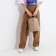 A backpack with a zipper, 2 outer pockets, beige color