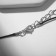 Piece on the Black Night cord in framing, white color in silver on a black lace, 35 cm