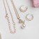 Set "Chosulka" 3 objects: pendant 40 cm, 2 rings, flower, white color in gold