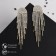 Hanging earrings with “comet” rhinestones, white color in gold, 8.5 cm