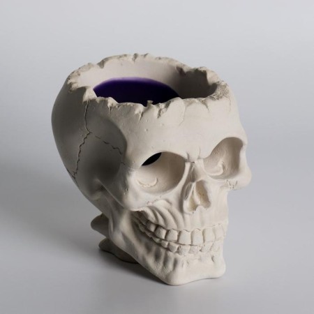 Figure candle in concrete "Crying skull", purple-2