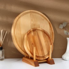 A set of cutting boards on the stand 