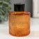 Diffusor for essential oils with a “flower” lid is a transparent orange 100 ml 6x6x8 cm