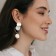 Earrings with pearl "sia" crumpled discs, white color in gold