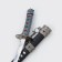 Suv. Product Katana-Mini 2B1 on a stand, black scabbard with white rhombuses 16/20cm mix