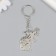 Metal keychain "Bunny with a butterfly on the nose" 5x3.4 cm