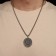 Kolovrat pendant-cooler is glowing, the color is black silver, 60 cm