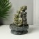The desktop fountain from the Buddha with Flower Waterfall network is gray 20.5x20.5x27 cm