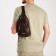 Male sling bag, artificial leather, headphone opening, brown color