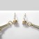 Earms with Eiffel Tower Rhinas, white color in gold