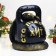 The piggy bank "Snake with weights" is black, 25 cm
