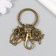 Trick Metal with carbine "Eagle and Flower" Bronze 6 cm