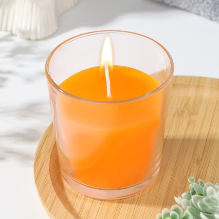 Candle in a smooth glass flavored "juicy mango", 8.5 cm