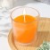 Candle in a smooth glass flavored "juicy mango", 8.5 cm