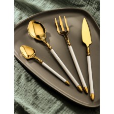 A set of cutlery made of stainless steel Magistro Ocean, 4 objects, the color of the metal of the gold, the handle is white