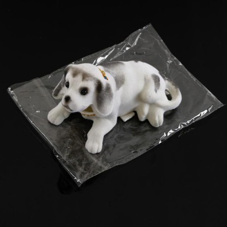 Dog on a car panel shocking his head, large, white color-6