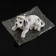 Dog on a car panel shocking his head, large, white color