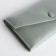 Women's wallet on the button, green color