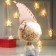 Interior doll "Grandpa in a fur coat and pink cap" 48x16x21 cm