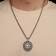 Kolovrat pendant-cooler is glowing, the color is black silver, 60 cm