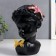 Polystone souvenir "Baby with lily in her hair and butterfly" Black 23x17x7 cm