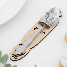 A teaspoon spoon with an engraving 