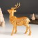Souvenir Polystone "Golden Deer with a wreath on the neck" 11.8x5.7x16.8 cm
