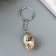 Keychain plastic "shell in a cage" with gold 3x2x1.2 cm