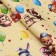 Paper packing glossy bilateral "animals with balls", 100 x 70 cm